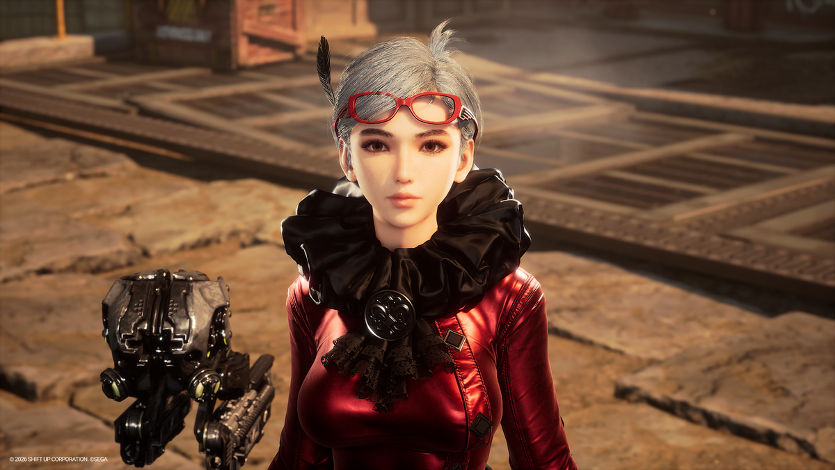 A digital character portrait of a woman with short gray hair, red goggles, and a black ruffled collar, wearing a shiny red dress, standing in a stone environment with a futuristic mechanical object at her side.