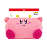 A pink Kirby plush pillow with a sad face, shown in its original retail packaging. The packaging features a red Nintendo Switch 2 logo at the top and a Kirby Media logo on the right.