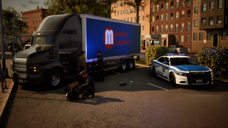 A large semi-truck with a blue side panel reading Madrid Logística is parked in an urban lot alongside a white and blue police car. Several people are gathered around the truck, and brick buildings, trees, and pavement are visible in the background.