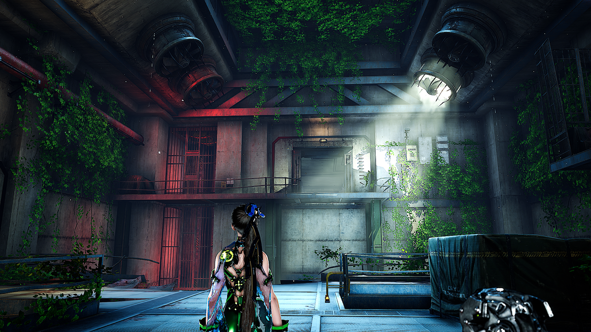 A video game scene showing a female character with long dark hair and glowing green accents standing in a dimly lit industrial interior with vines growing through the walls and beams.